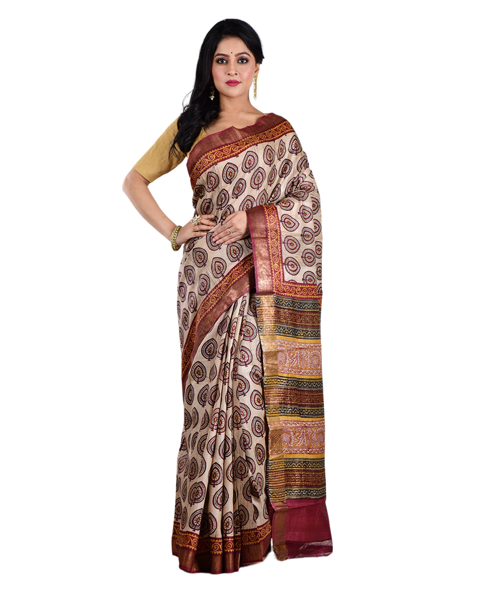 Beige maroon hand printed tussar silk saree