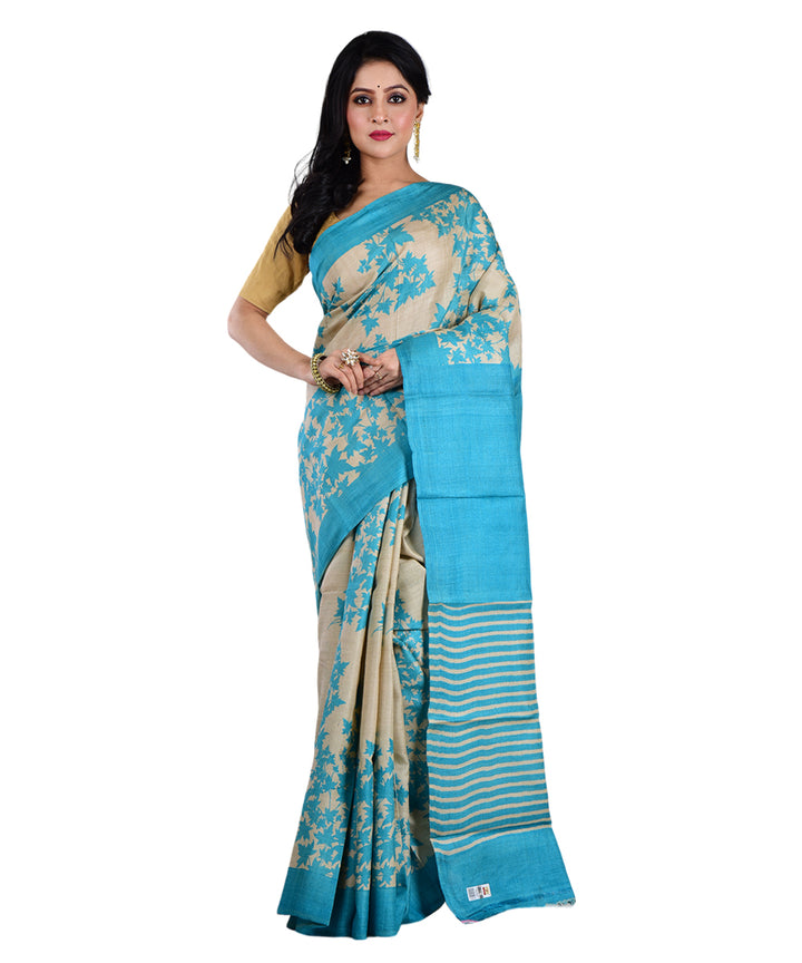 Beige sky blue hand printed tussar silk saree