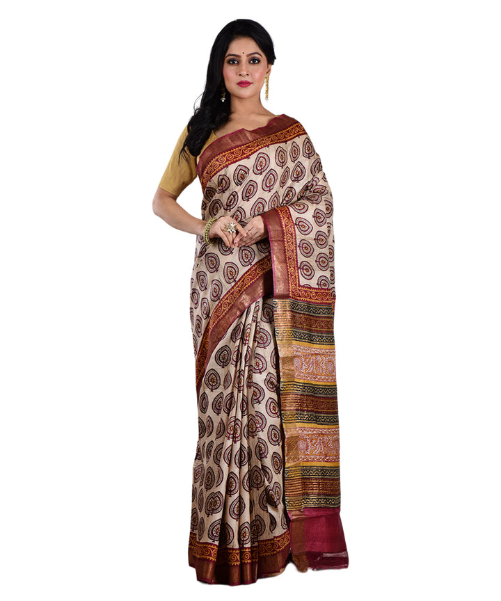 Beige maroon hand printed tussar silk saree