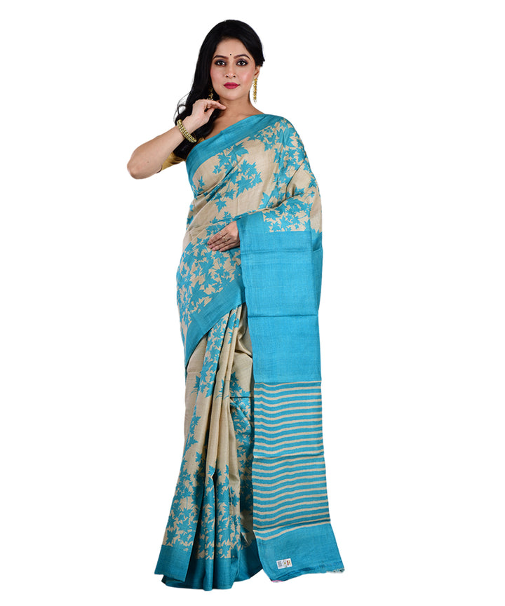 Beige sky blue hand printed tussar silk saree