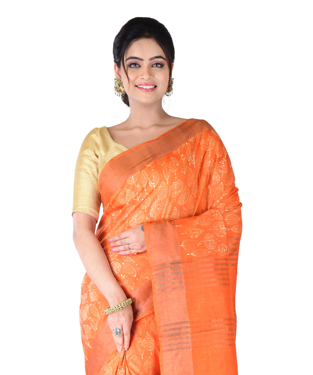 Orange hand printed silk saree