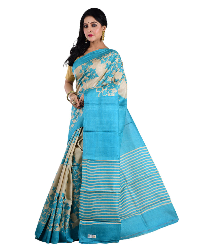 Beige sky blue hand printed tussar silk saree