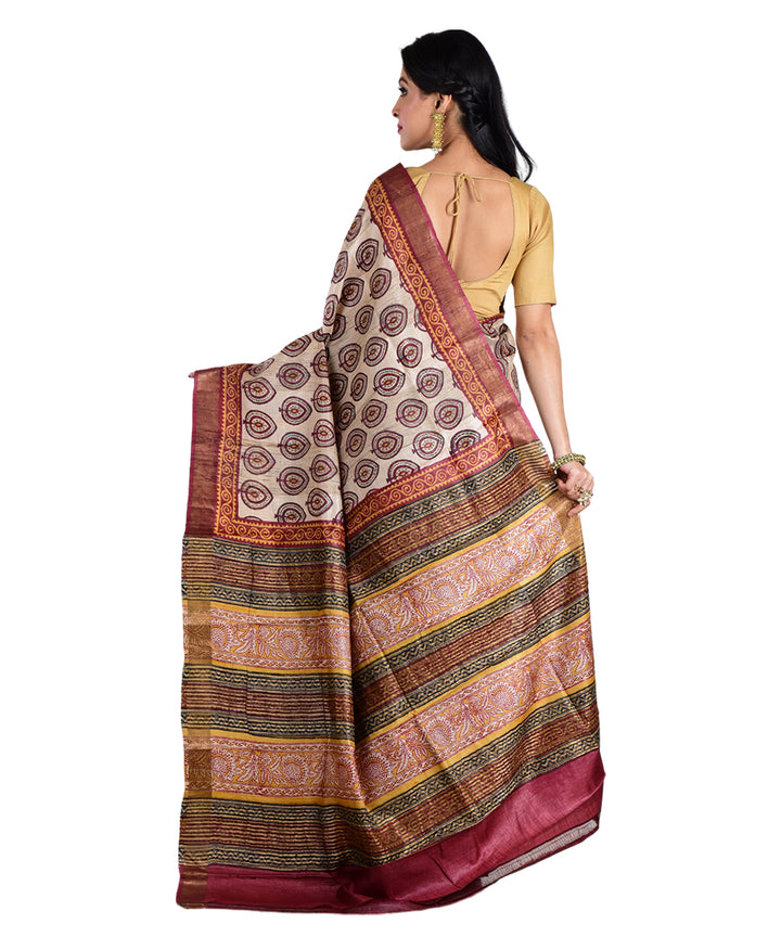 Beige maroon hand printed tussar silk saree