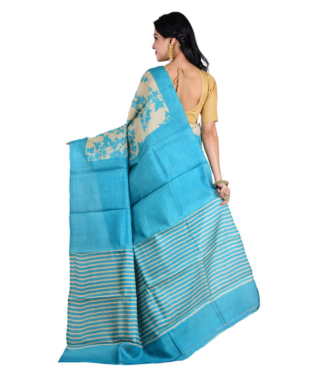 Beige sky blue hand printed tussar silk saree