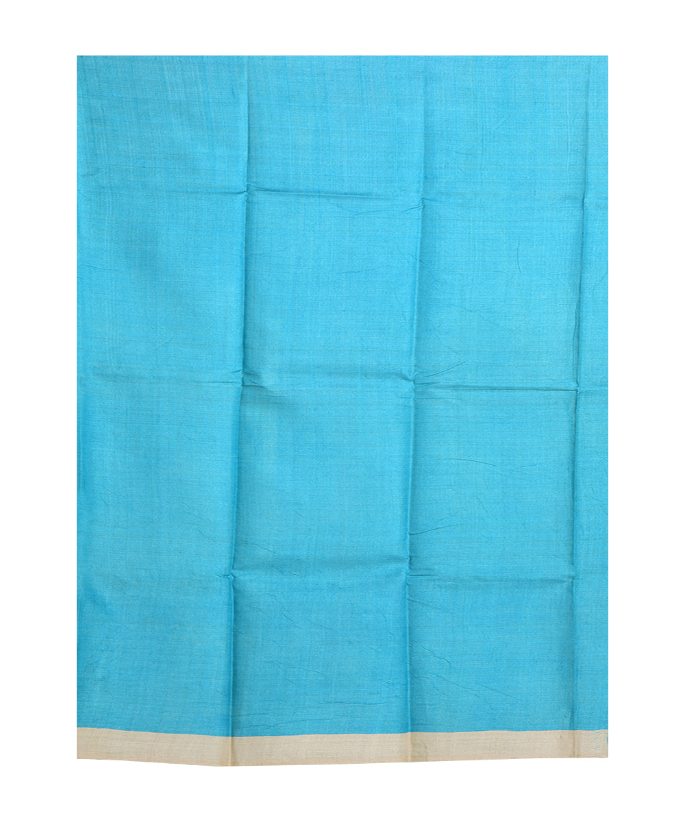 Beige sky blue hand printed tussar silk saree