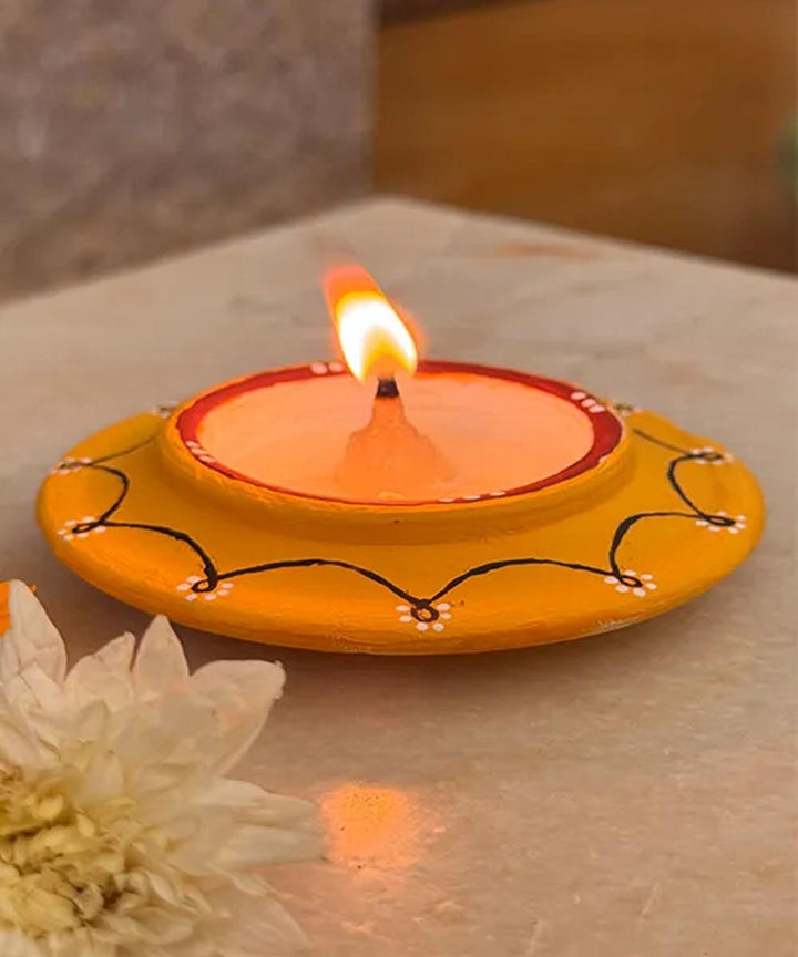 Yellow handcrafted decor terracotta disc diya- Set of 8