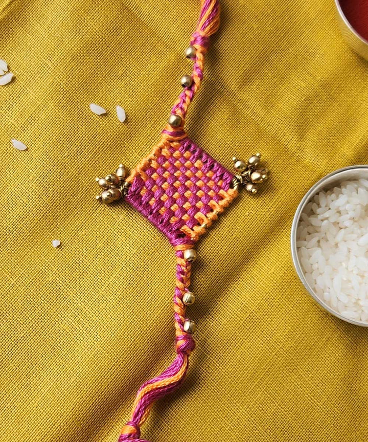 Handcrafted orange pink mercerised cotton rakhi