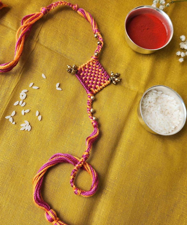 Handcrafted orange pink mercerised cotton rakhi