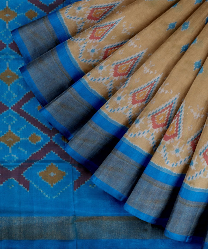 Beige neon blue handwoven pochampally ikat silk saree