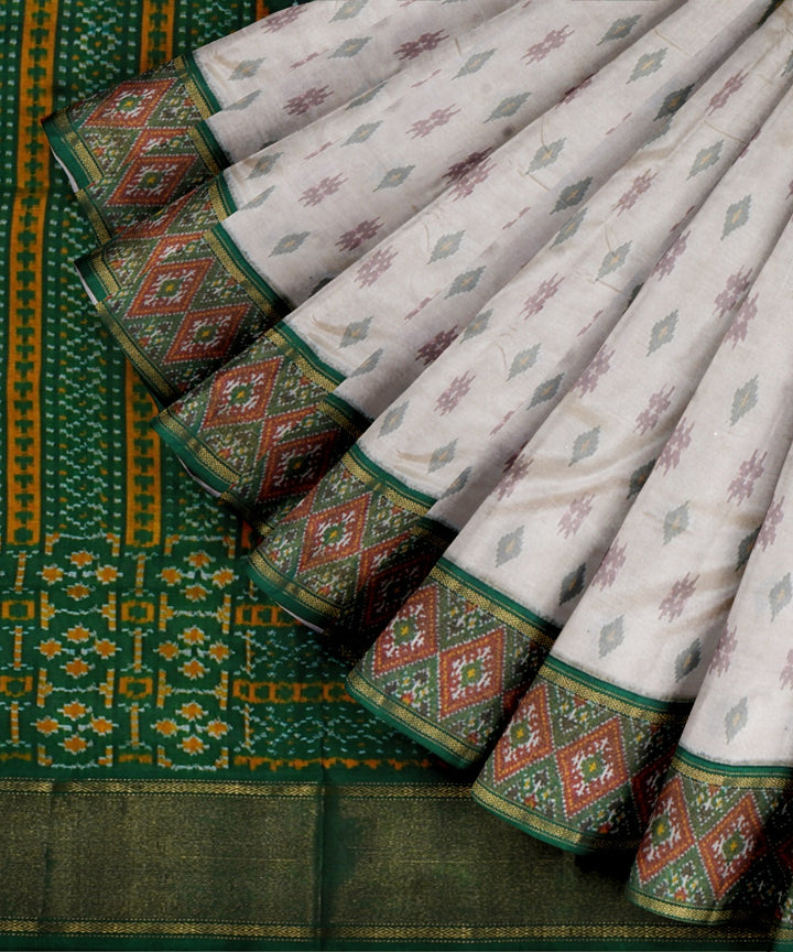 White dark green handwoven pochampally ikat silk saree