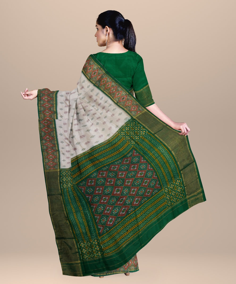 White dark green handwoven pochampally ikat silk saree