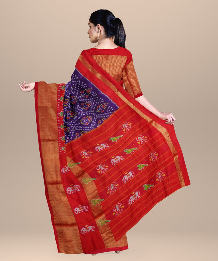 Navy blue orange handwoven pochampally ikat silk saree