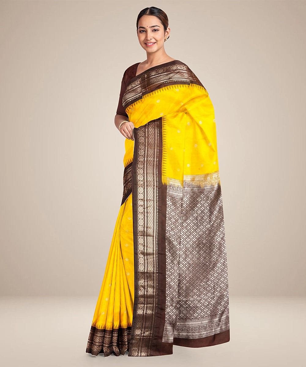 Yellow black handwoven gadwal silk saree