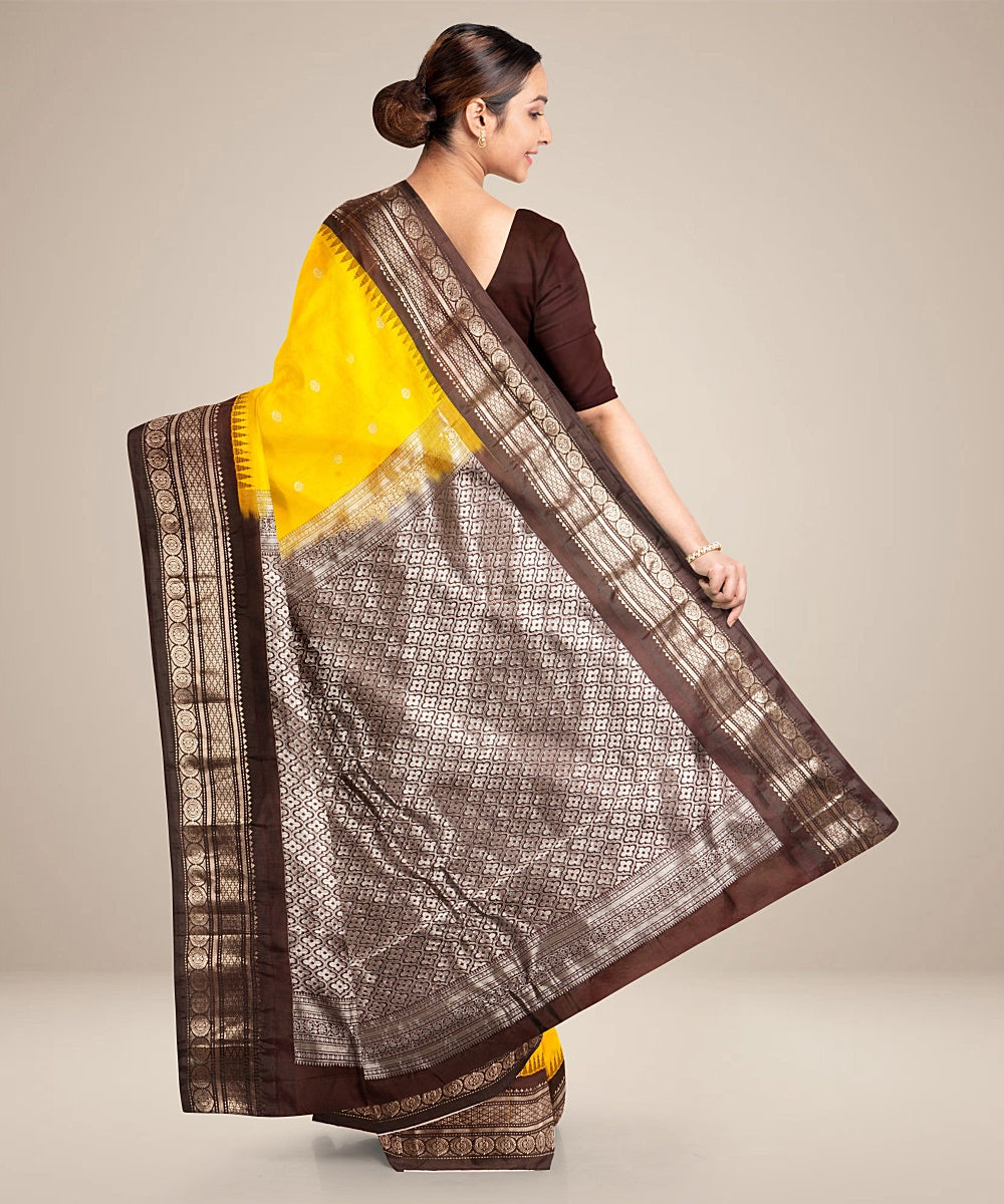 Yellow black handwoven gadwal silk saree