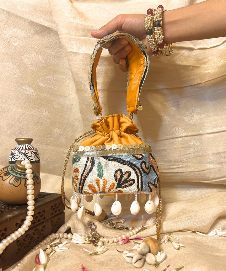 Lemon yellow hand embroidered kashmiri potli bag
