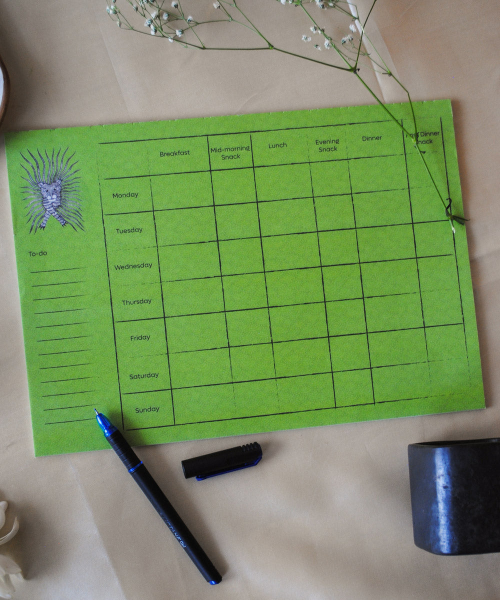 Green handcrafted gond art kitchen menu planner