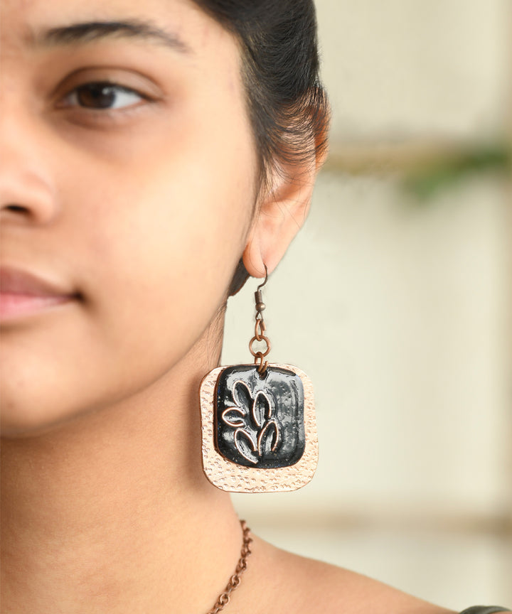 Black golden handcrafted leaf motif copper enamel earrings