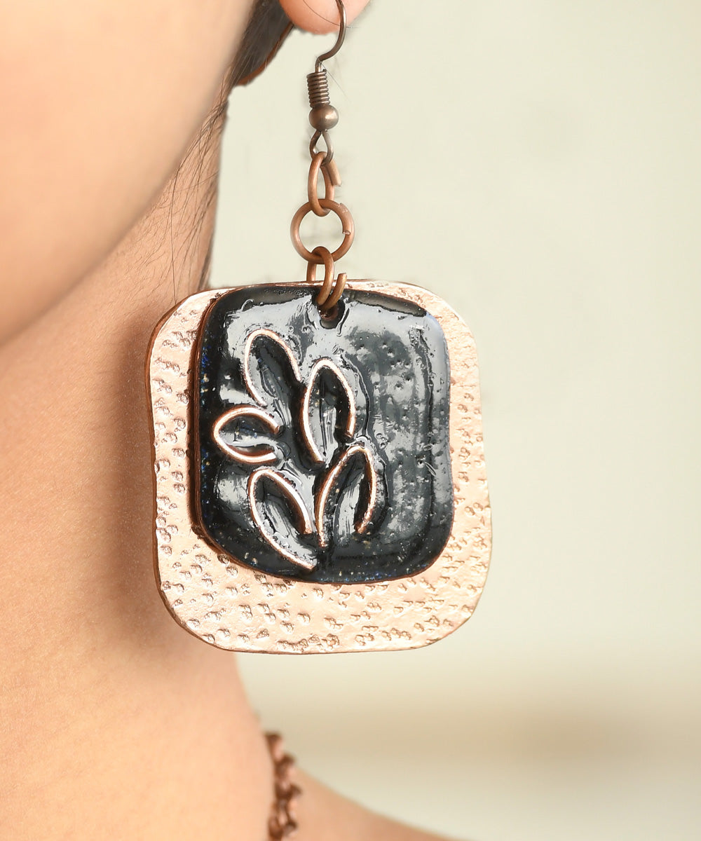 Black golden handcrafted leaf motif copper enamel earrings
