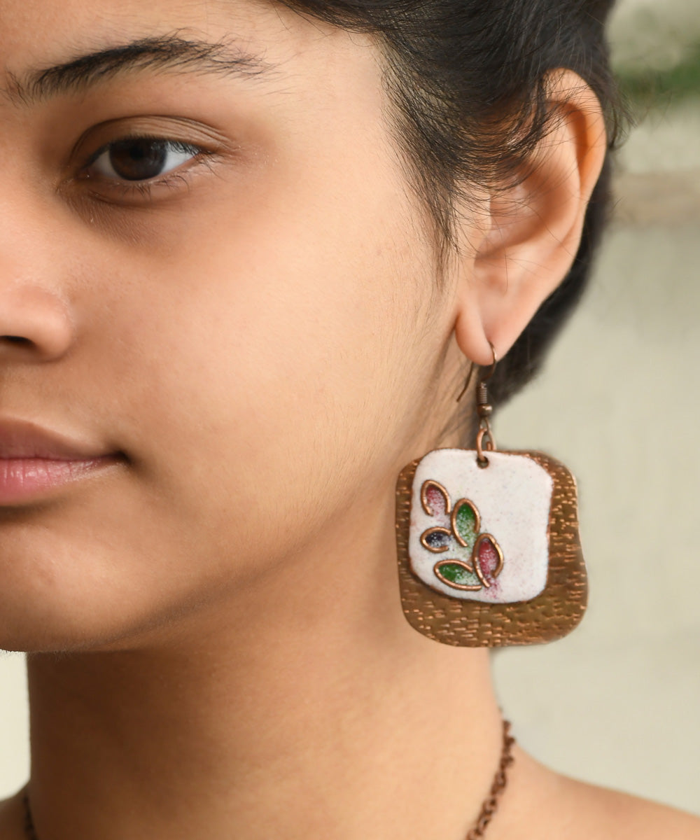 White golden handcrafted leaf motif copper enamel earrings