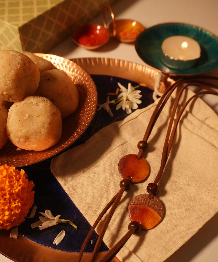 Handcrafted ambar textured copper enamel rakhi