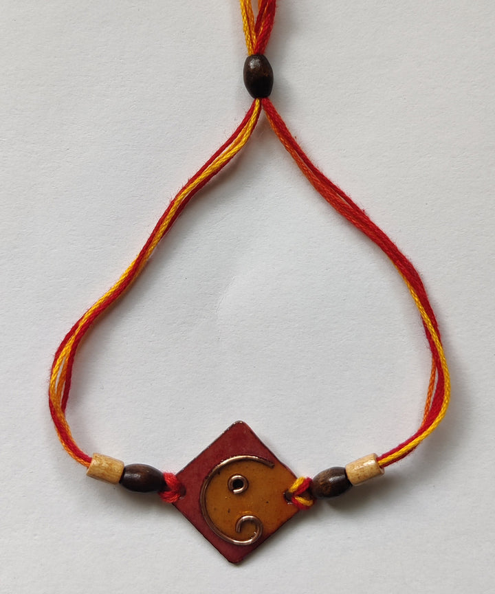 Yellow orange handcrafted copper enamel rakhi