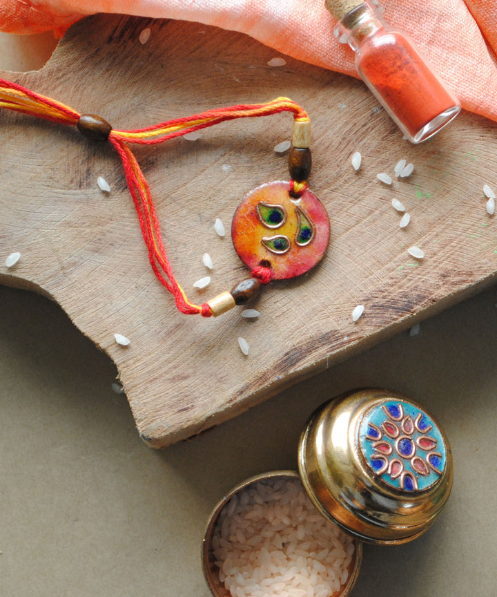 Orange handmade copper enamel rakhi