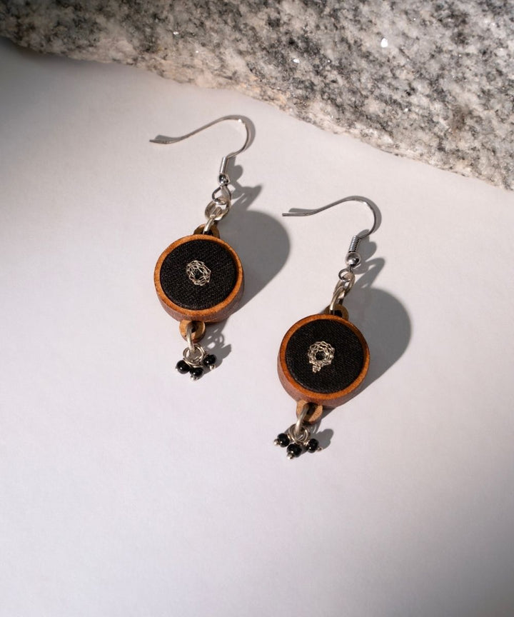 Black fabric and repurposed wood danglers