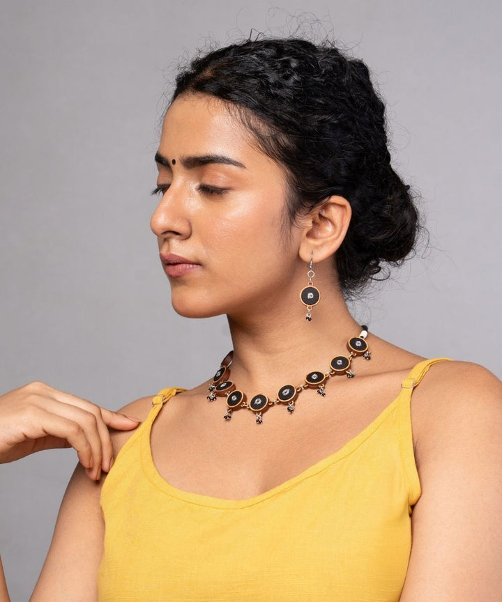 Black fabric and repurposed wood danglers
