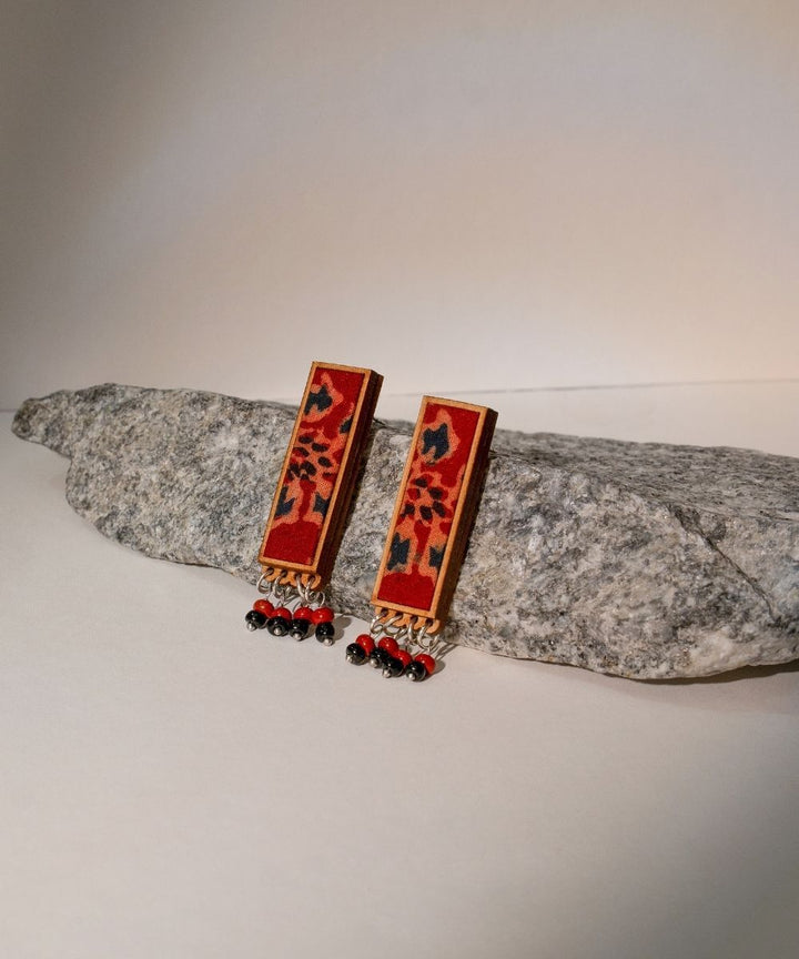 Red ajrakh repurposed fabric and wood studs with beads