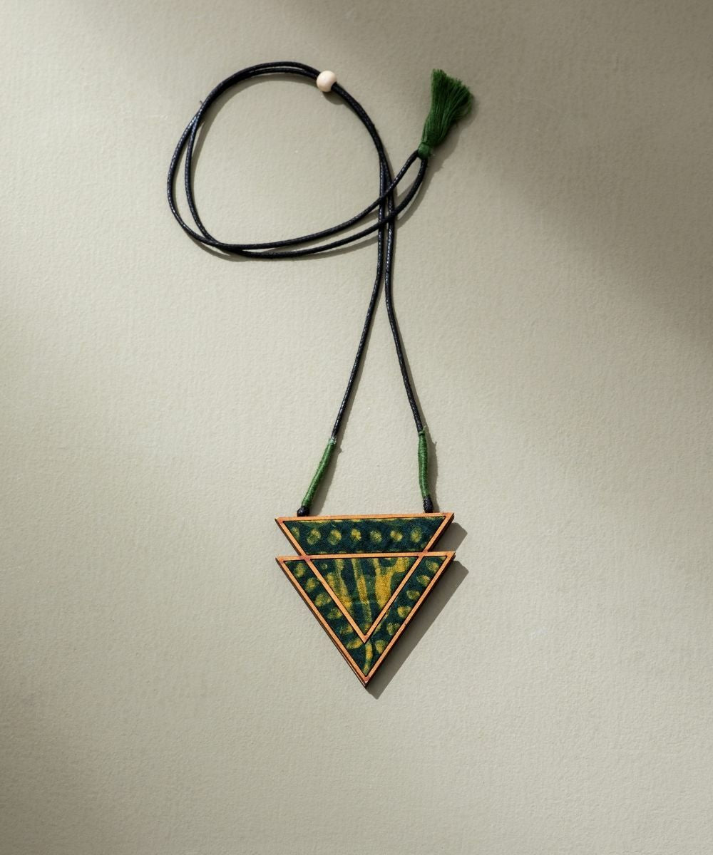 Green batik triangular pendant made of repurposed fabric wood
