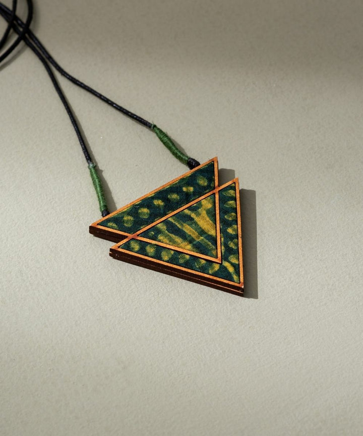 Green batik triangular pendant made of repurposed fabric wood
