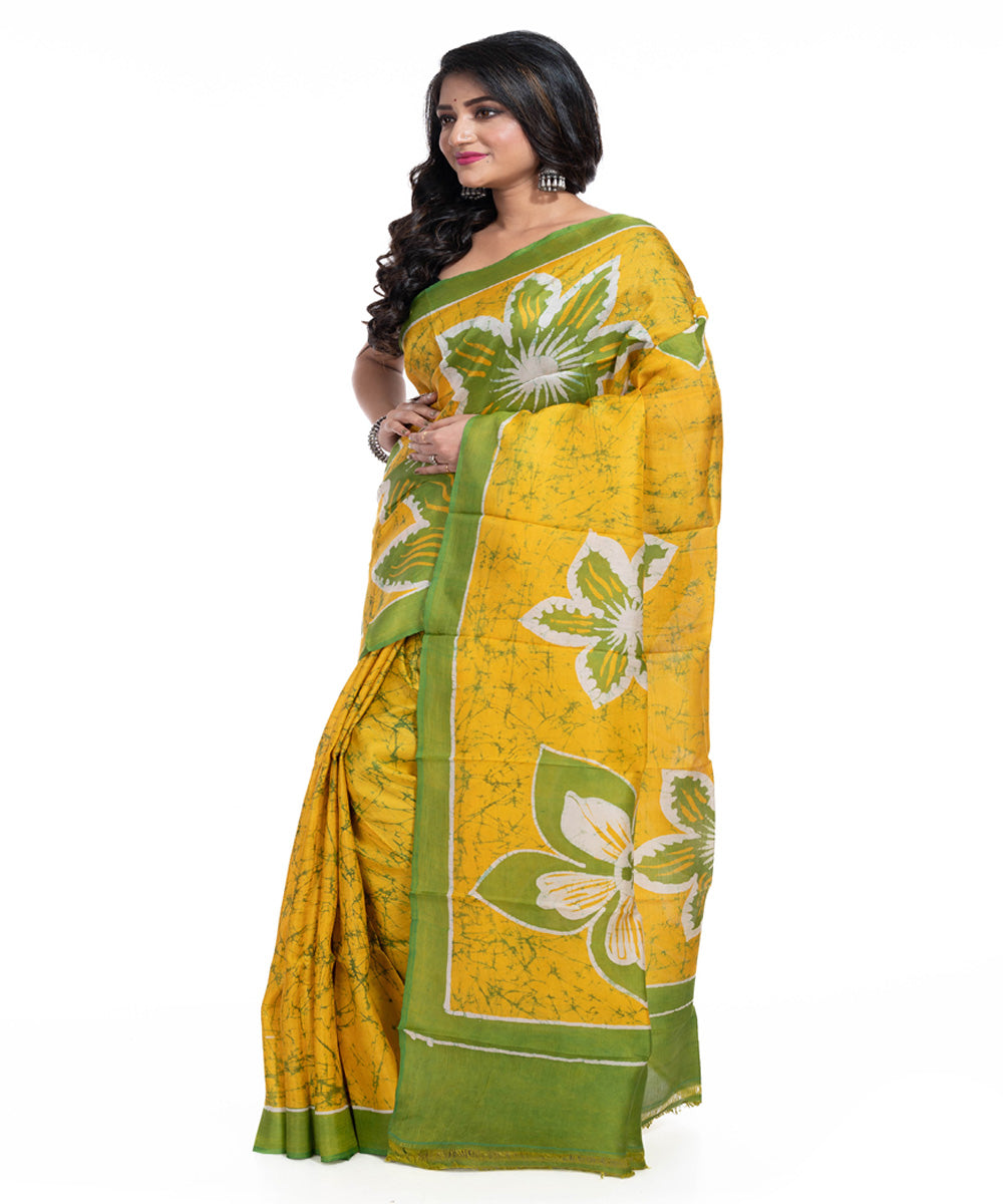 Yellow green silk handwoven batik print saree