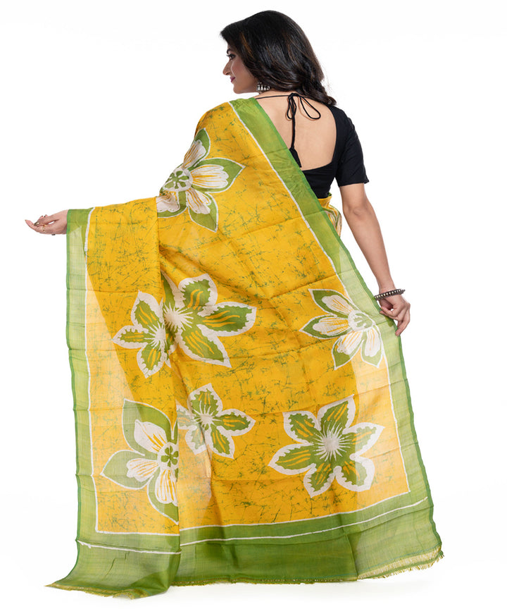 Yellow green silk handwoven batik print saree