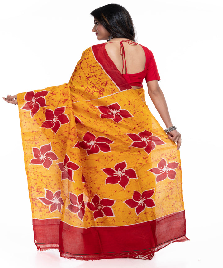 Yellow red handwoven batik print silk saree