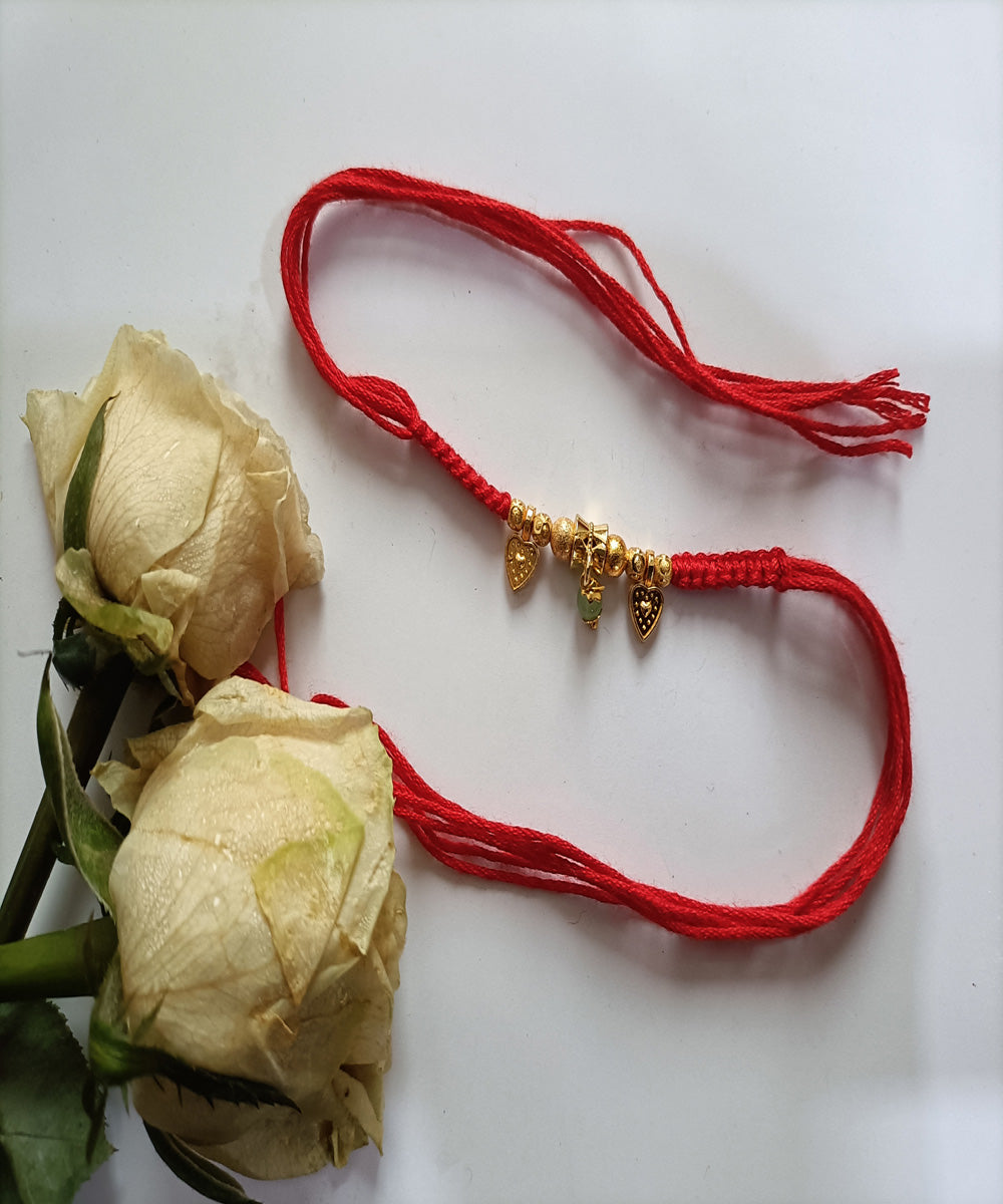 Red handmade woolen metal blessing rakhi
