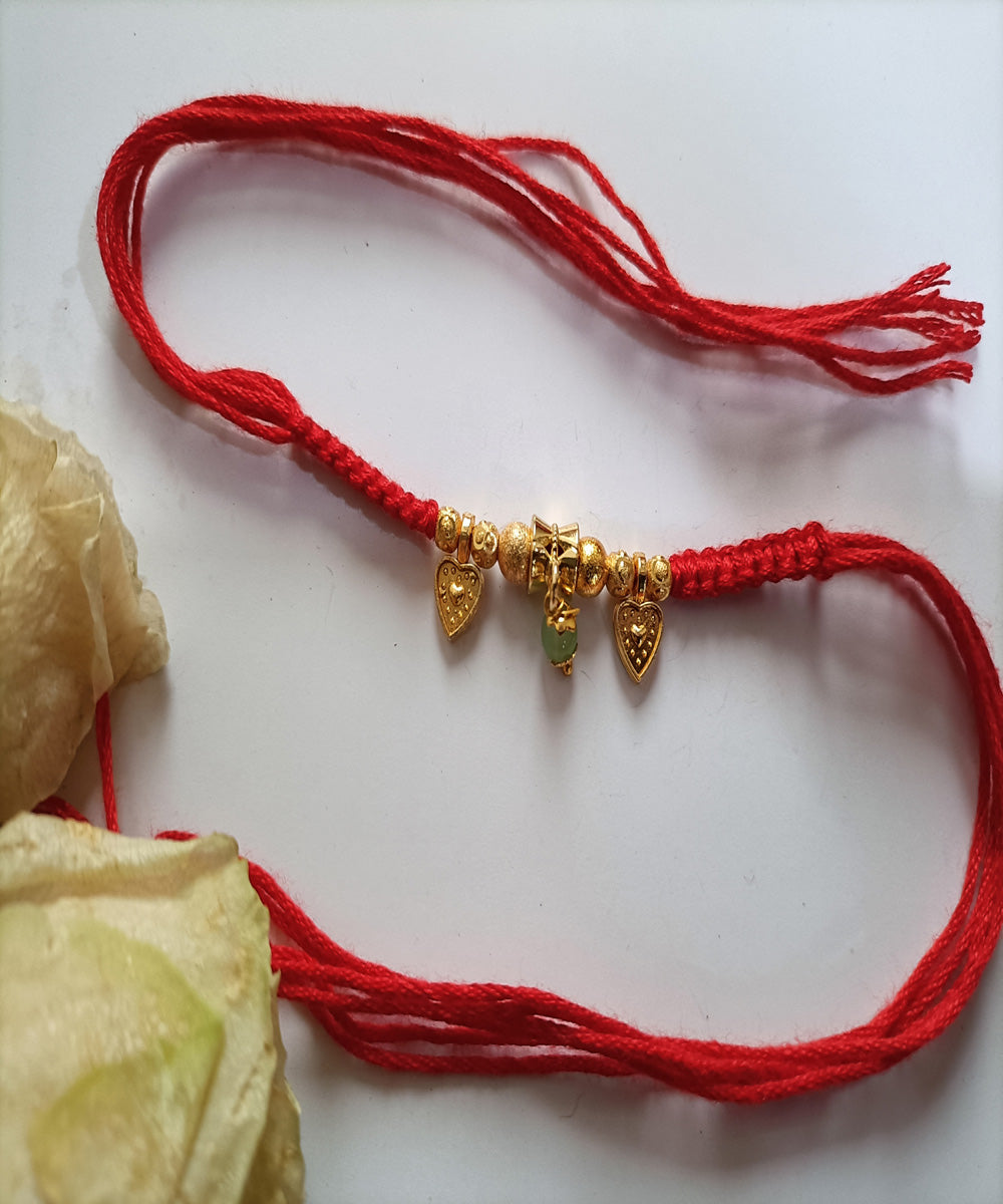 Red handmade woolen metal blessing rakhi