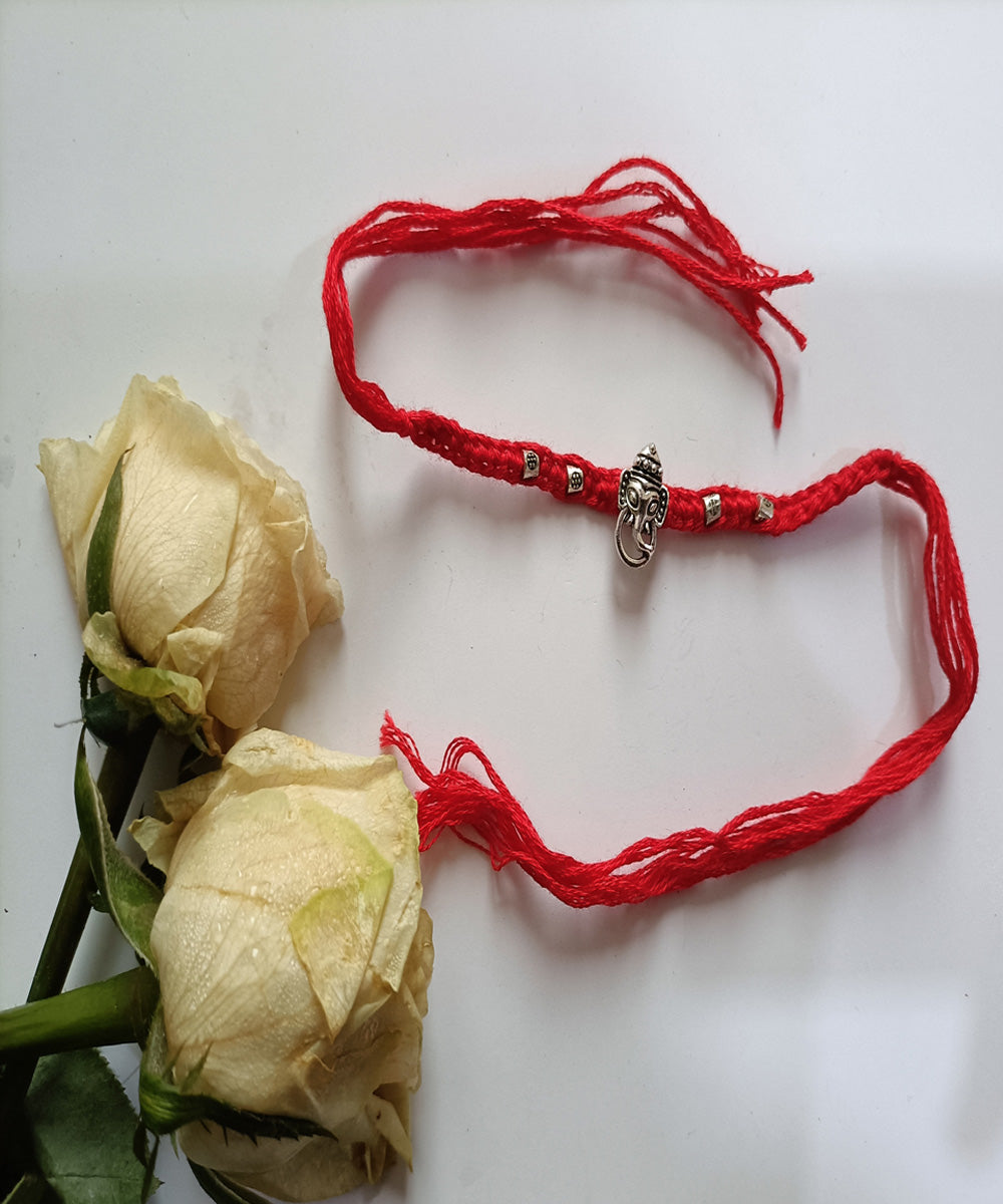 Handmade woolen red metal blessing rakhi