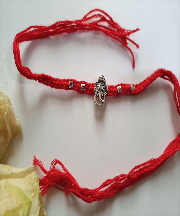 Handmade woolen red metal blessing rakhi