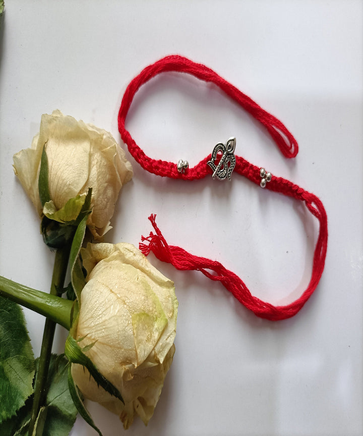 Handmade red woolen metal blessing rakhi