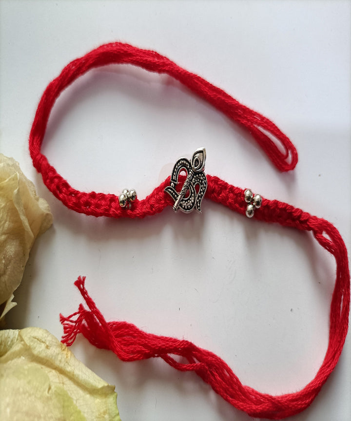 Handmade red woolen metal blessing rakhi
