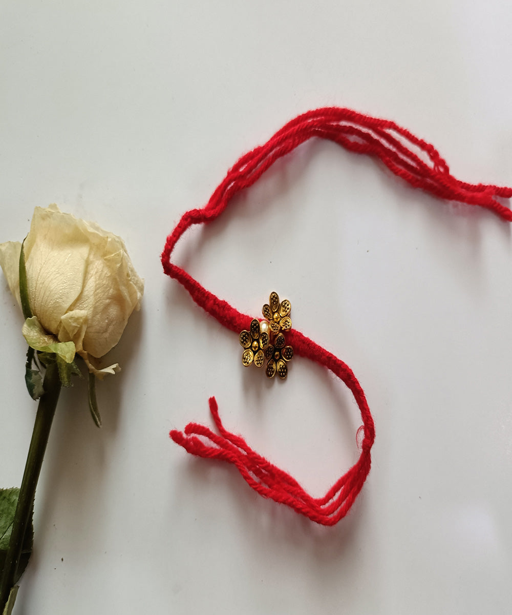 Handmade metal artisanal red woolen affections rakhi