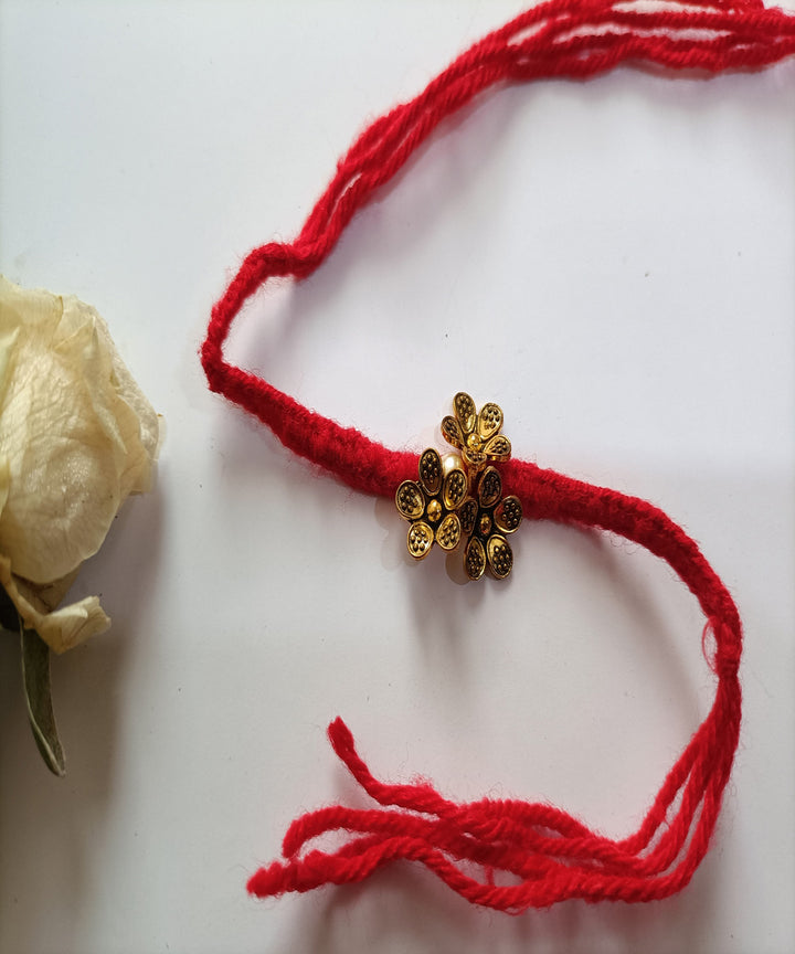 Handmade metal artisanal red woolen affections rakhi