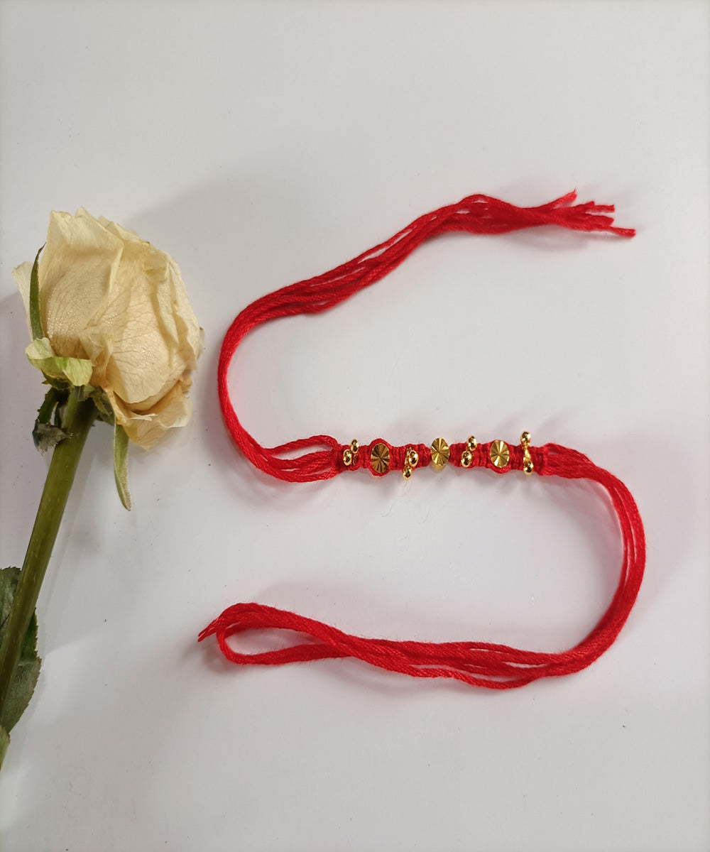 Red handcrafted woolen metal artisanal affections rakhi