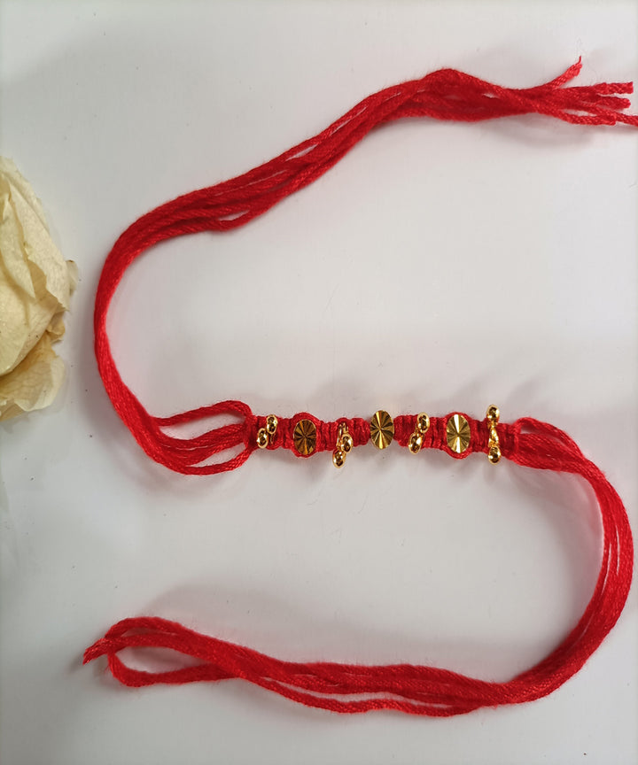 Red handcrafted woolen metal artisanal affections rakhi