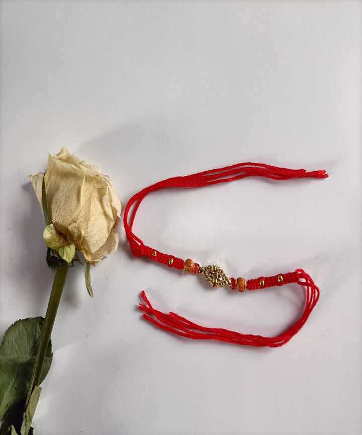 Handcrafted red woolen metal artisanal affections rakhi