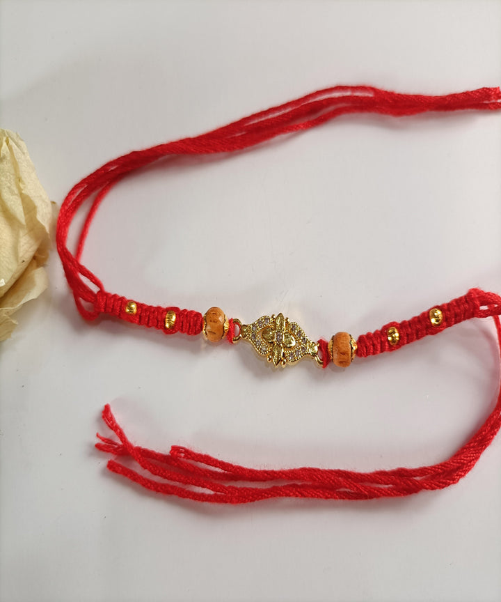 Handcrafted red woolen metal artisanal affections rakhi