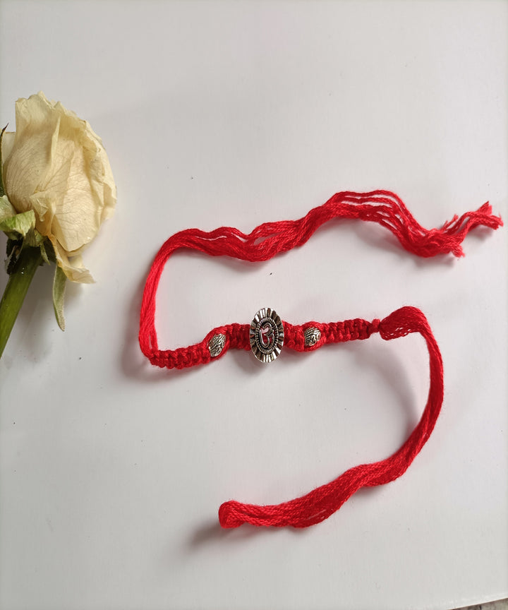 Handcrafted metal unique porsonalized red woolen rakhi