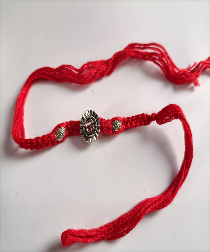 Handcrafted metal unique porsonalized red woolen rakhi