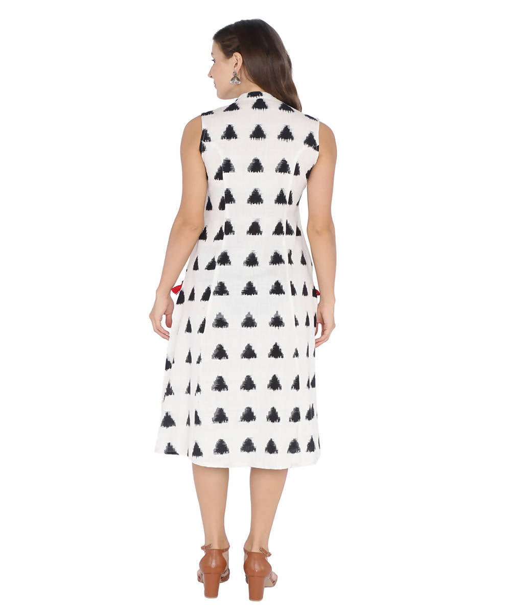 Sleeveless black and white double ikat cotton dress with embroidered pockets