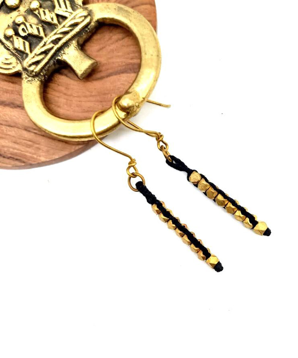 Golden metal and black thread handmade brass earring